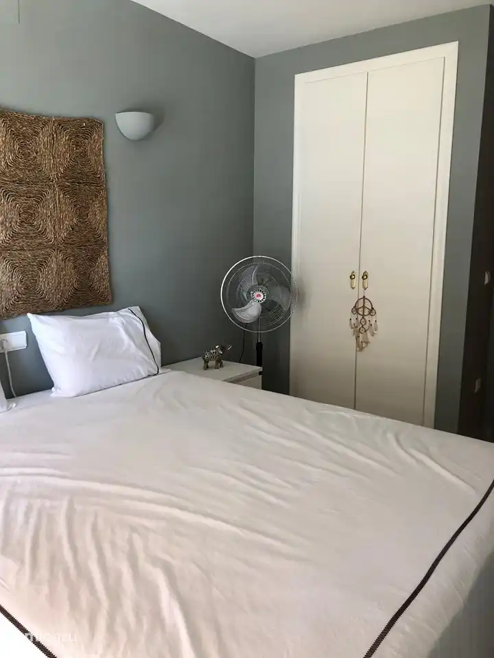 Bedroom 1 with a spacious closet with a hanging and laying area