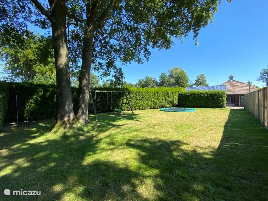 Large garden with trampoline, swings and the possibility of badminton.