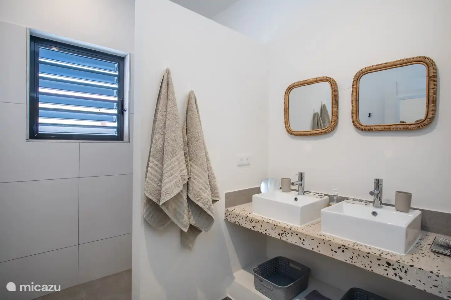Bathroom with two sinks and spacious shower