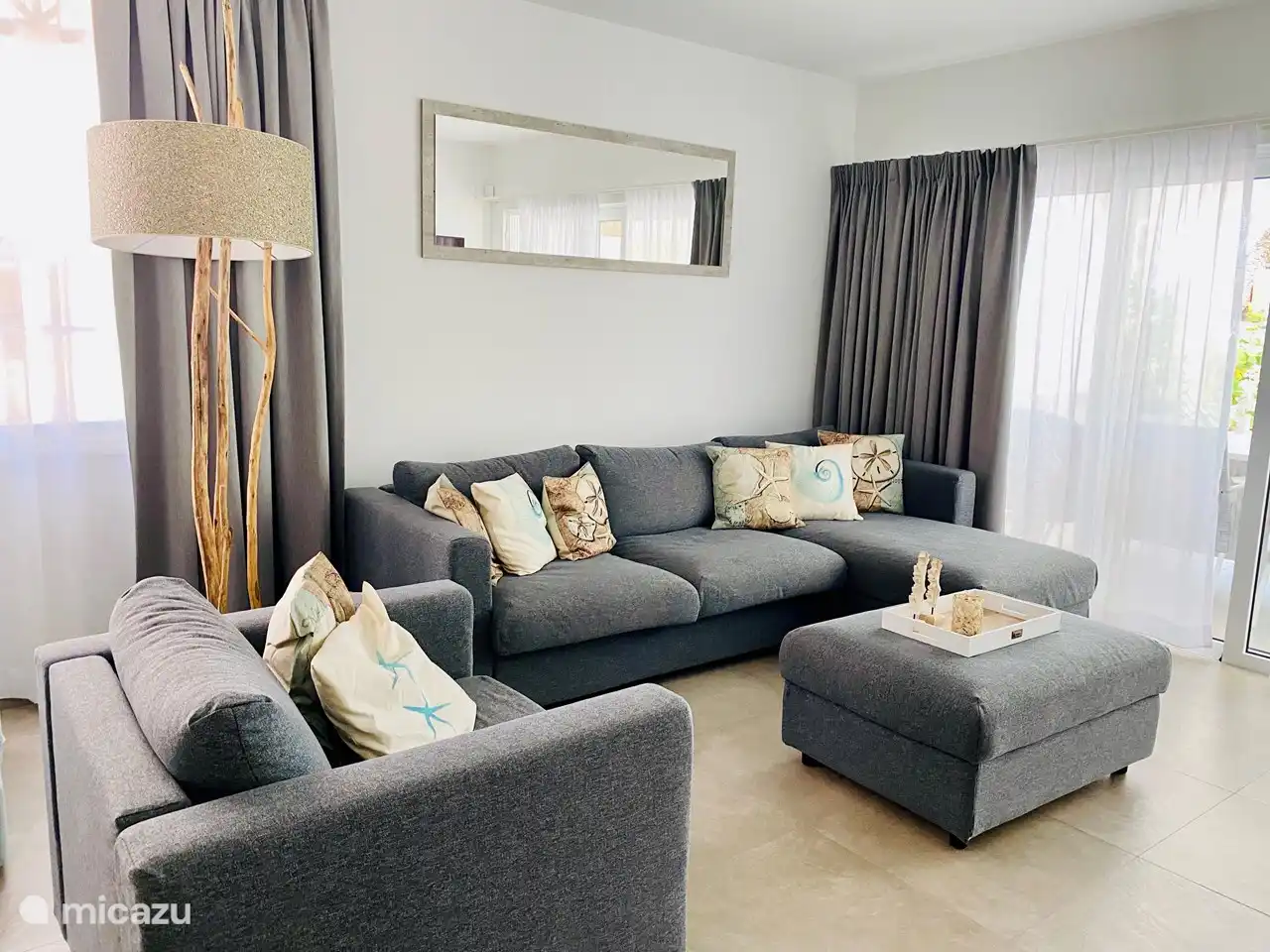 Living room with sleeping bed and blinded curtains