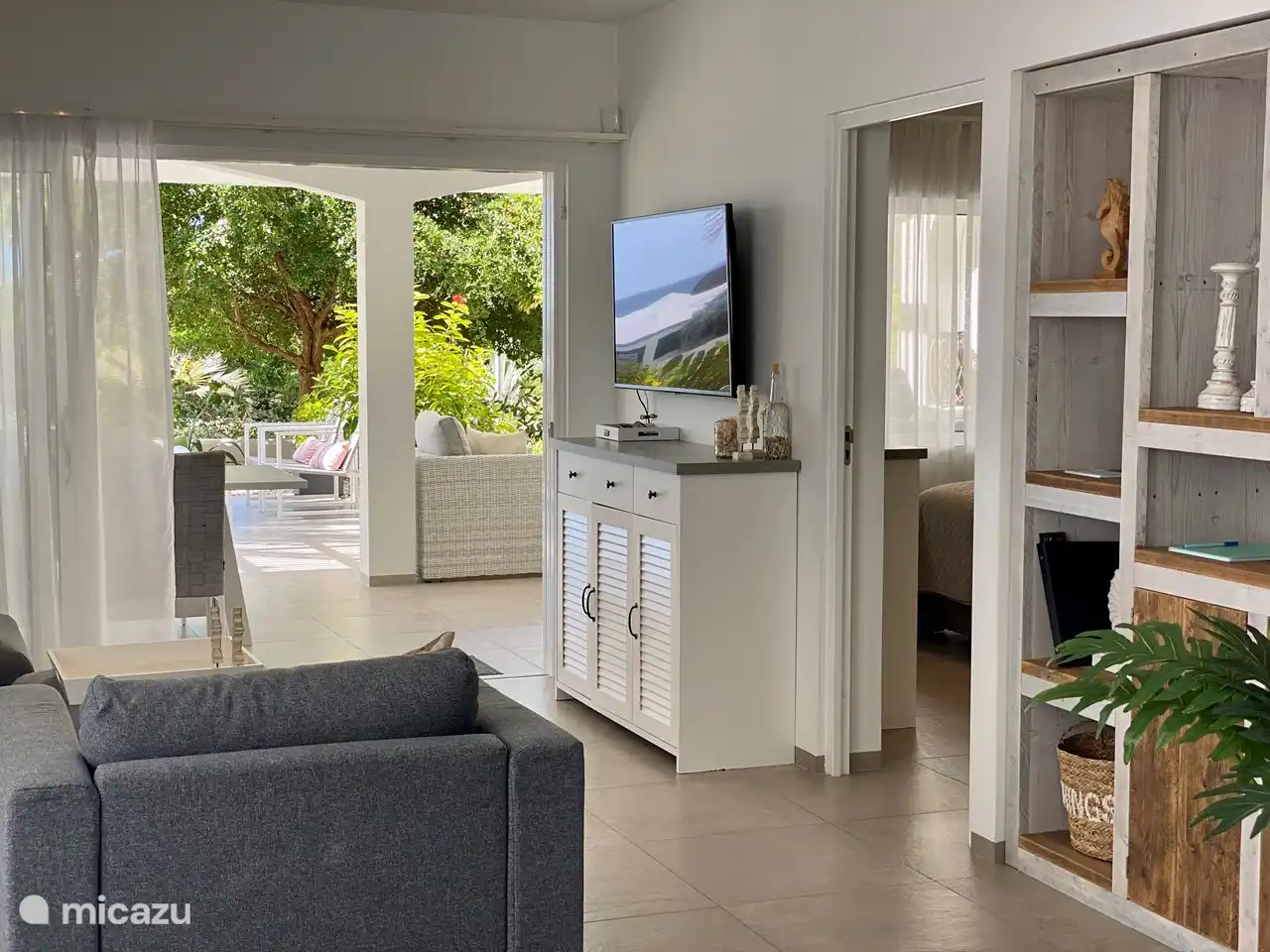 Living room with adjacent master bedroom