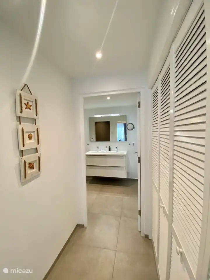 Walk in closet to the bathroom