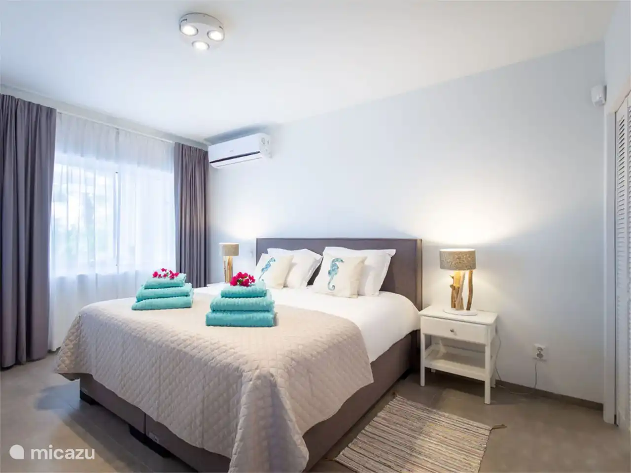 Master bedroom with garden view and adjoining bathroom