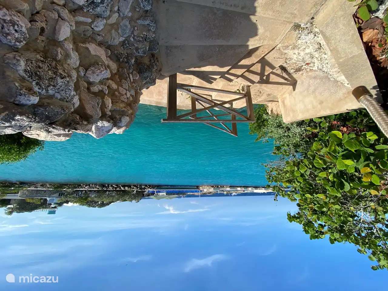 You can jump into the lagoon in front of the door