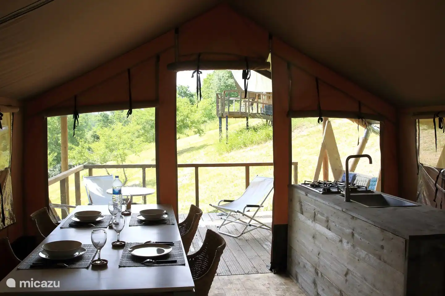 The living space of Panorama 1 with the sleeping tent in the background Panorama 2.