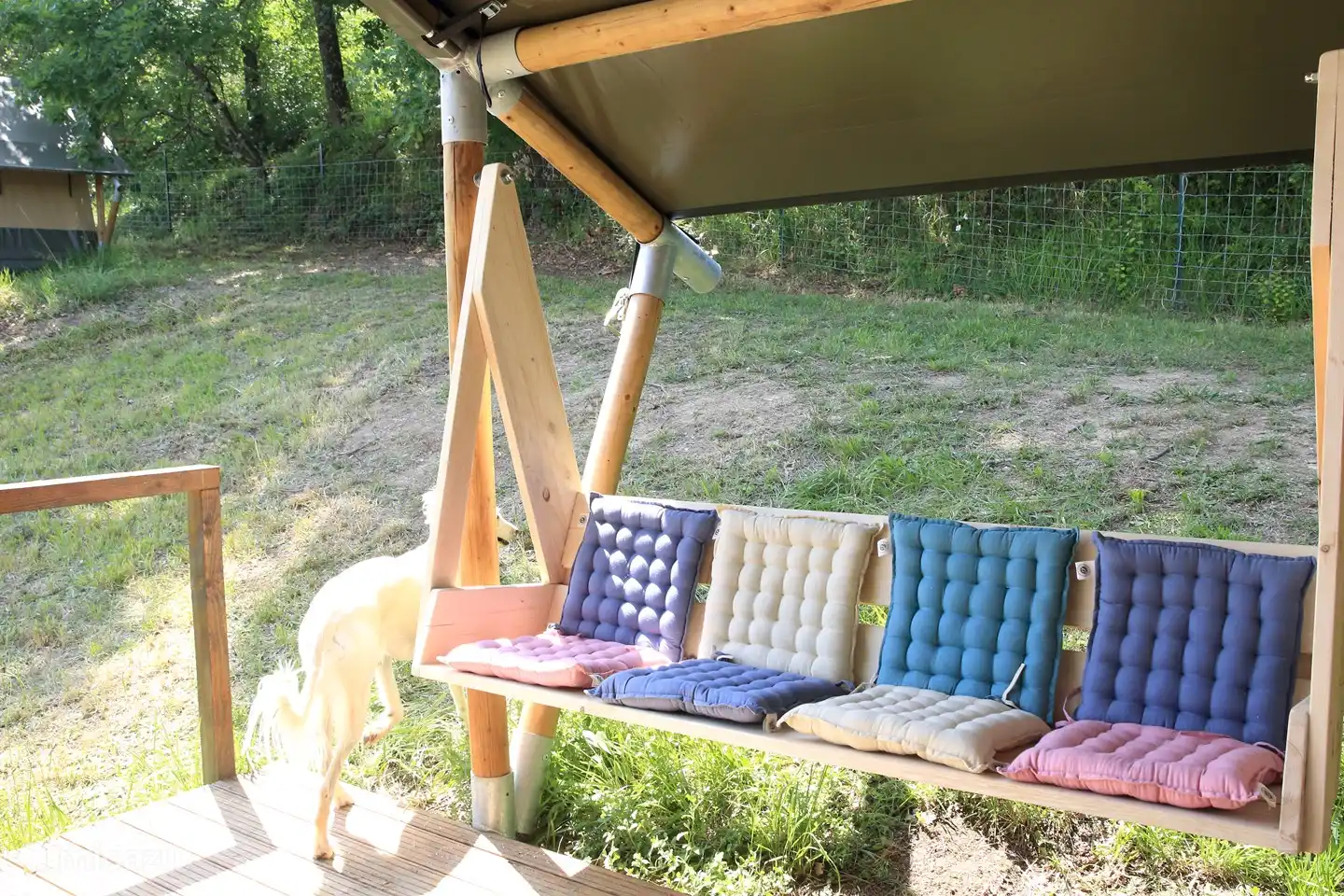 The porch swing on the porch.