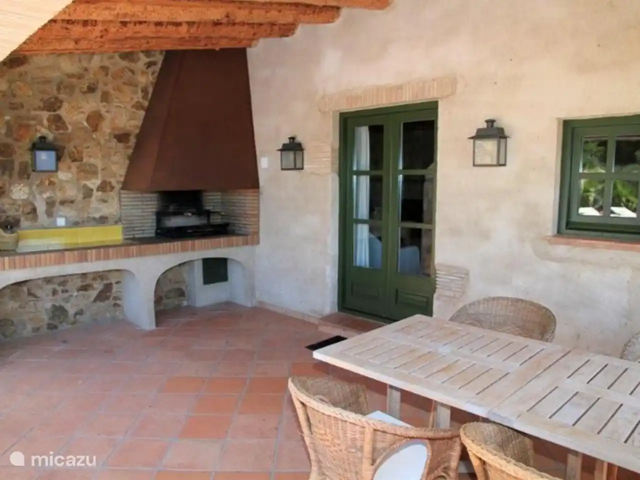 Covered terrace by swimming pool