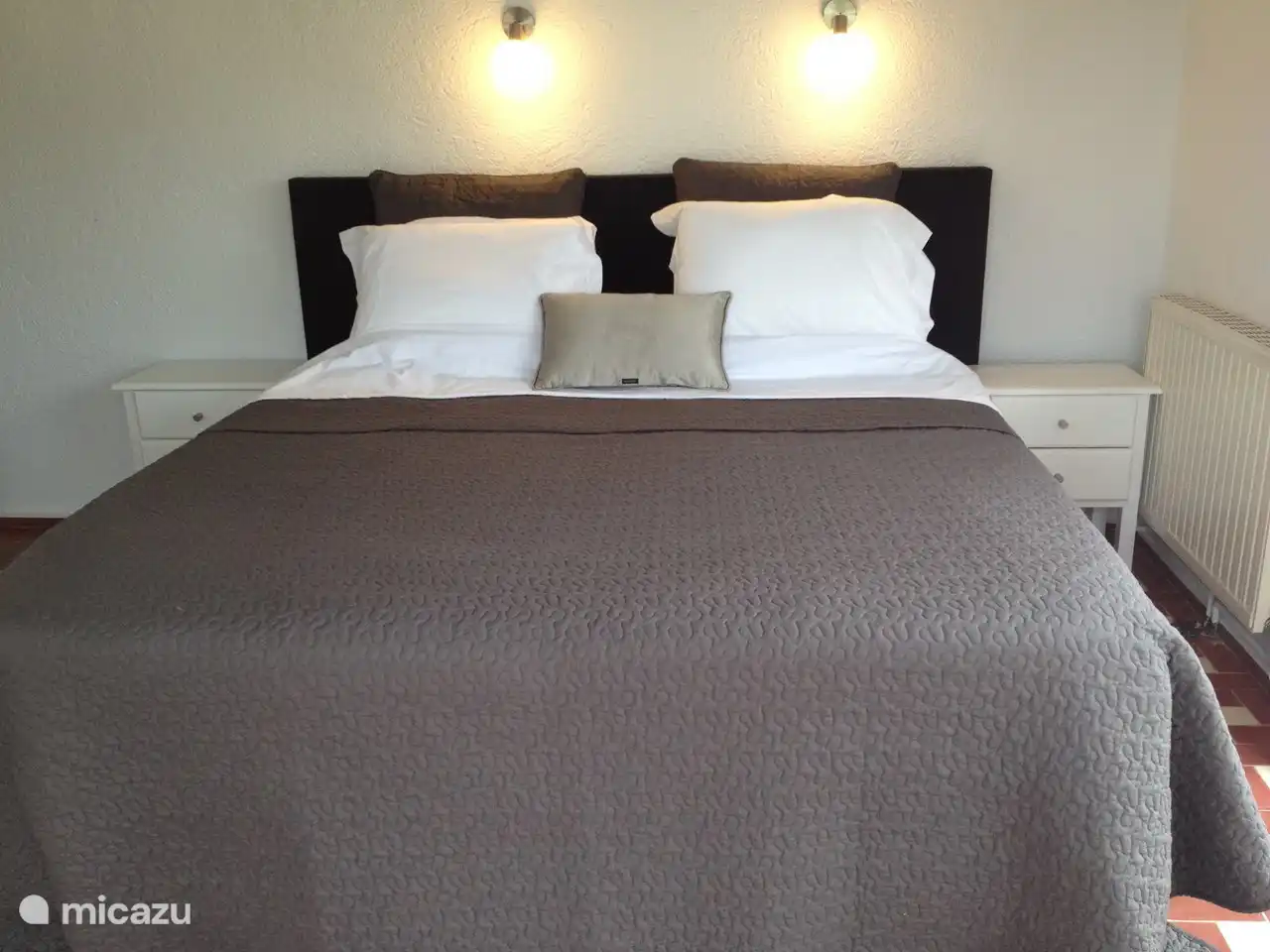 This room has a double box spring bed, air conditioning, large wardrobe, two very large windows with fantastic views that are equipped with shutters. This room has enough space to place a cot.