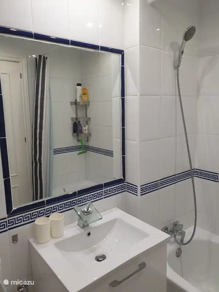 The bathroom with bathtub and shower