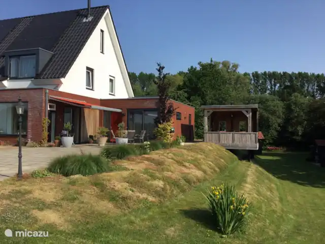 Location de Vacances Pays-Bas, Utrecht, Wijk bij Duurstede, maison de vacances - Lieu unique sur l'eau Une belle maison de vacances, tout commence par une belle véranda donnant sur l’eau