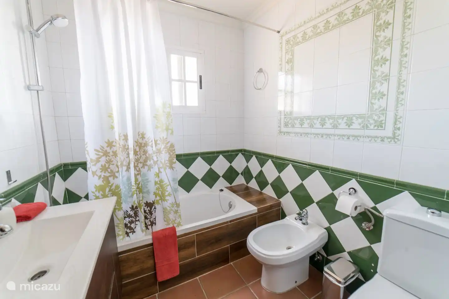 downstairs bathroom complete with bath / shower, sink, toilet and bidet. also equipped with: towels, toilet paper, hand soap and hairdryer.