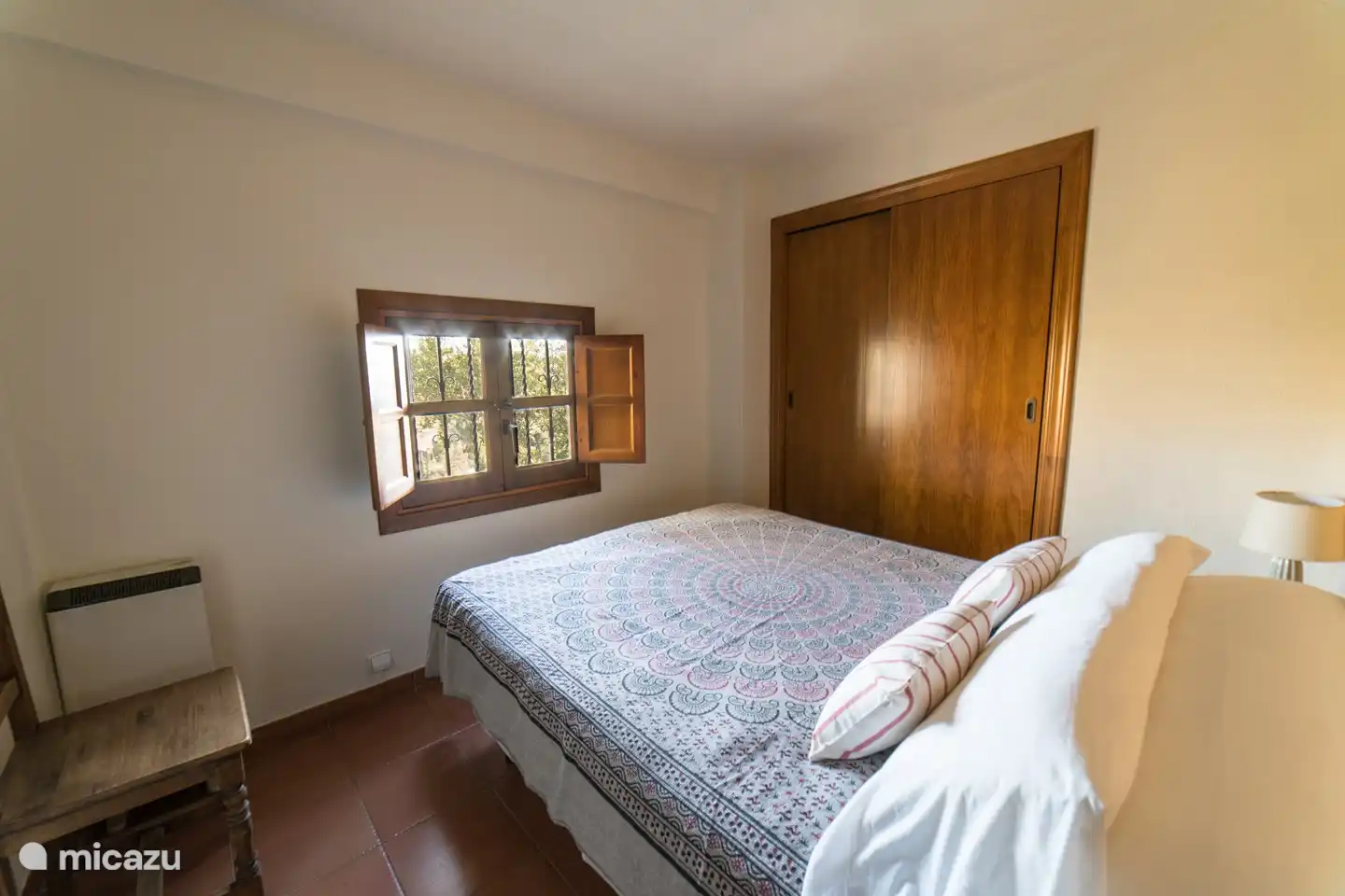 2nd bedroom with double bed and spacious fitted wardrobes.