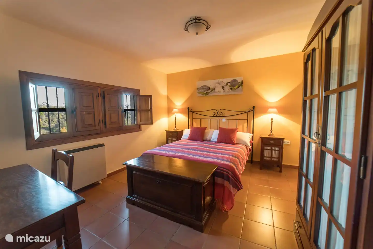 3rd bedroom with double bed, cupboard, desk + chair.