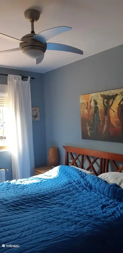 Bedroom ground floor with air conditioning and ceiling fan and private bathroom