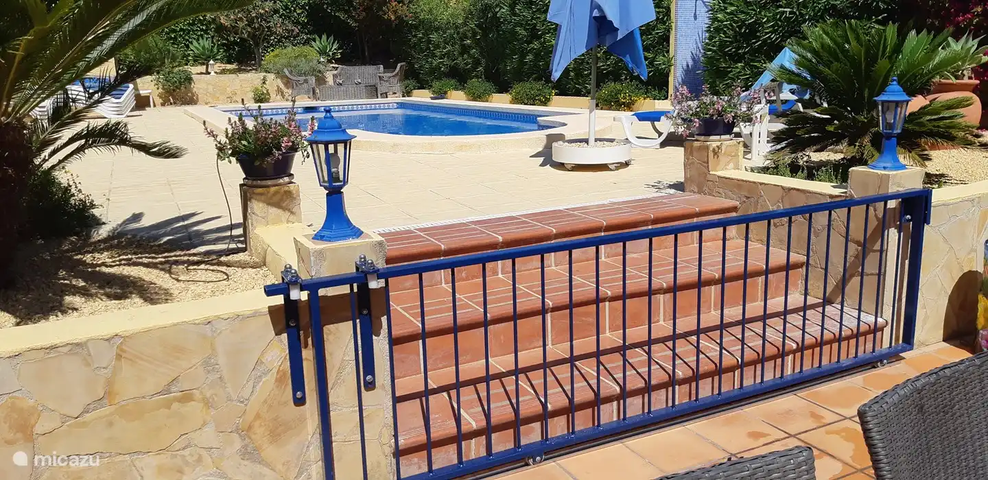 Extra child-safe access to the swimming pool with sliding gate in our deep garden with lots of privacy