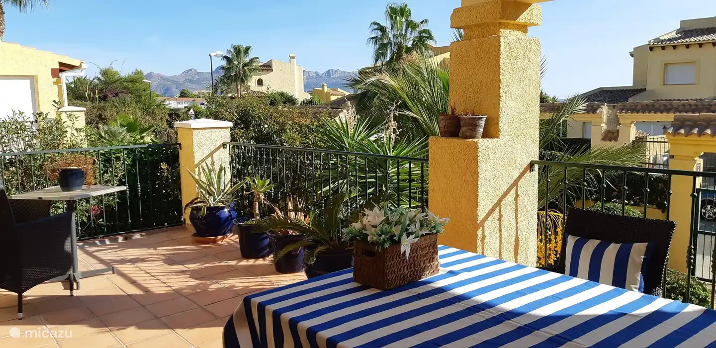 Our spacious front terrace with the morning sun rising over the sea, partly covered!