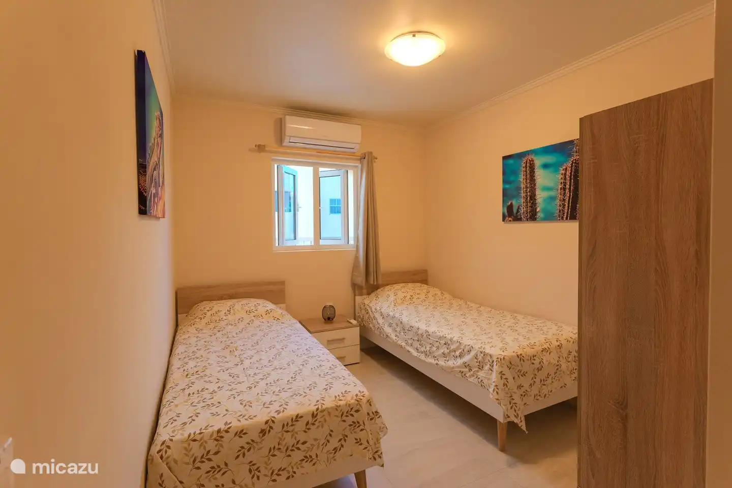 Eines der Schlafzimmer verfügt über 2 getrennte Betten, die auch nebeneinander gestellt werden können