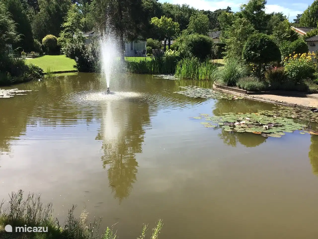Pond with splashing fountain, gives a relaxed feeling when you sit in the garden 