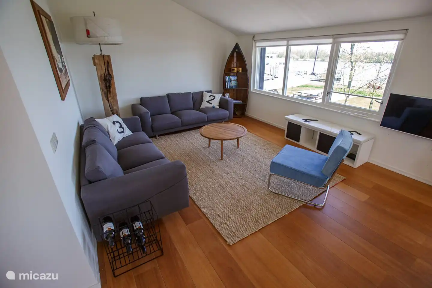 Sitting area in the spacious living room with a view of the water.
