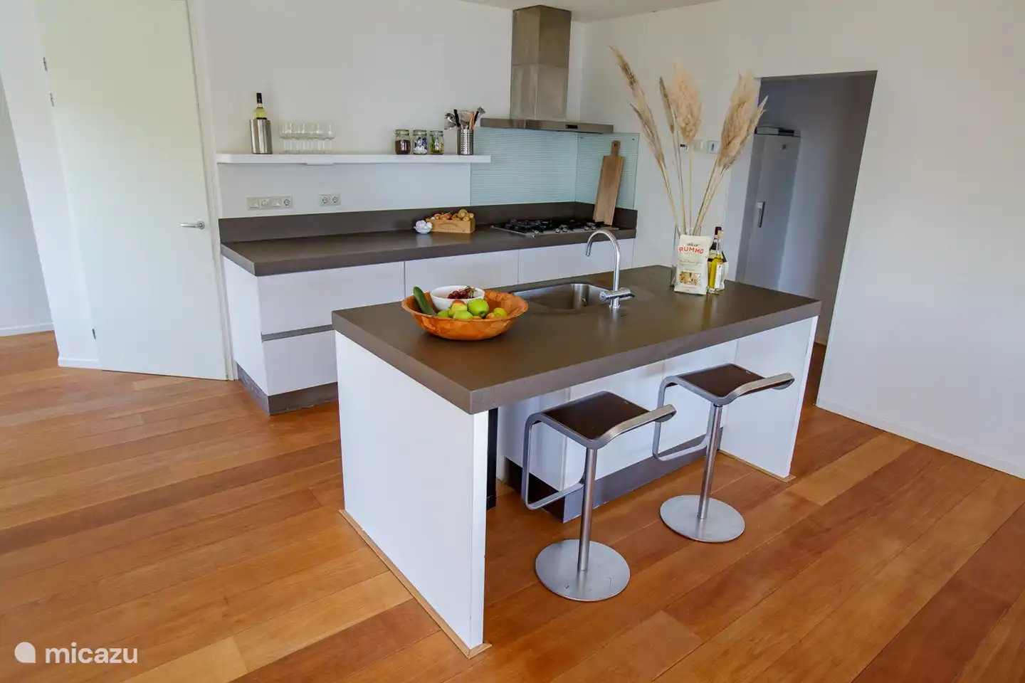 Modern kitchen with all amenities and kitchen island.