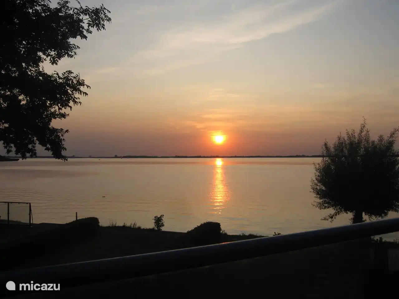 Ondergaande zon vanaf het balkon