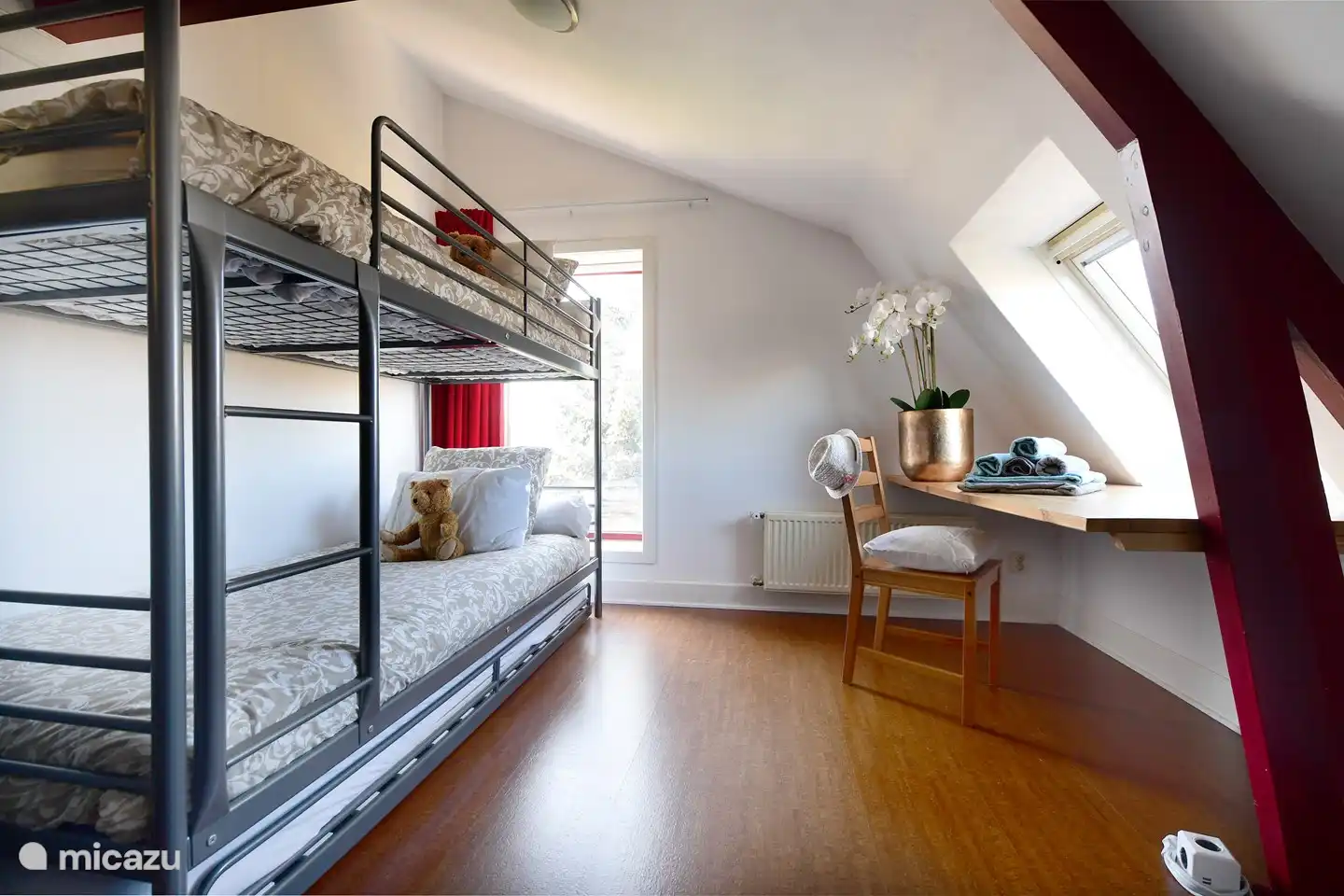 Bedroom with bunk beds and extra trundle bed