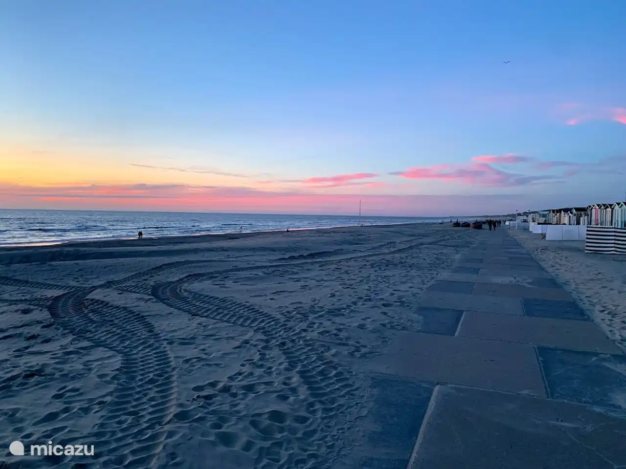 The wide beach of Wijk aan Zee with sunset