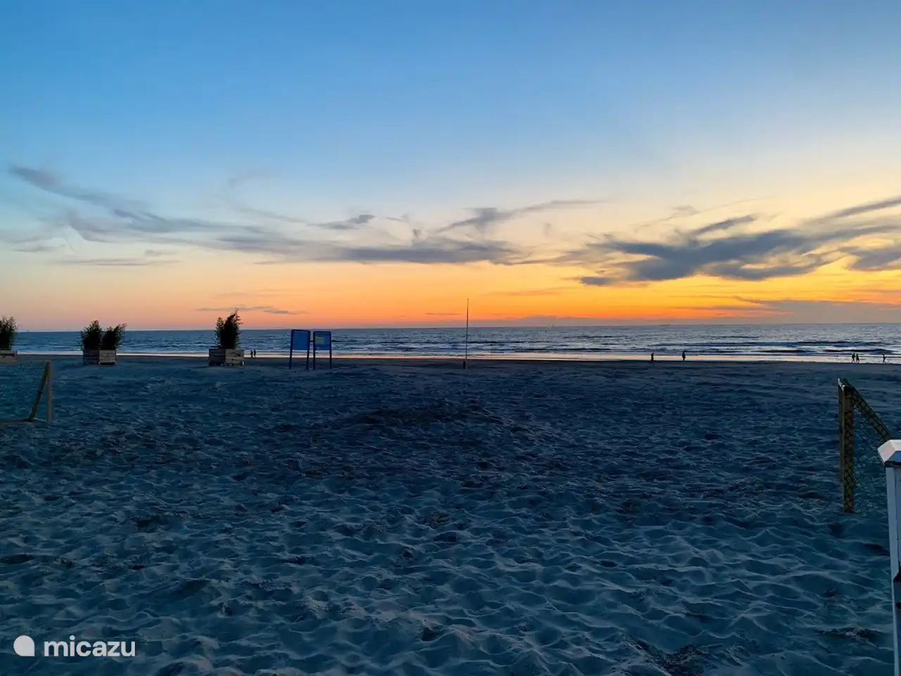 The wide beach of Wijk aan Zee with sunset