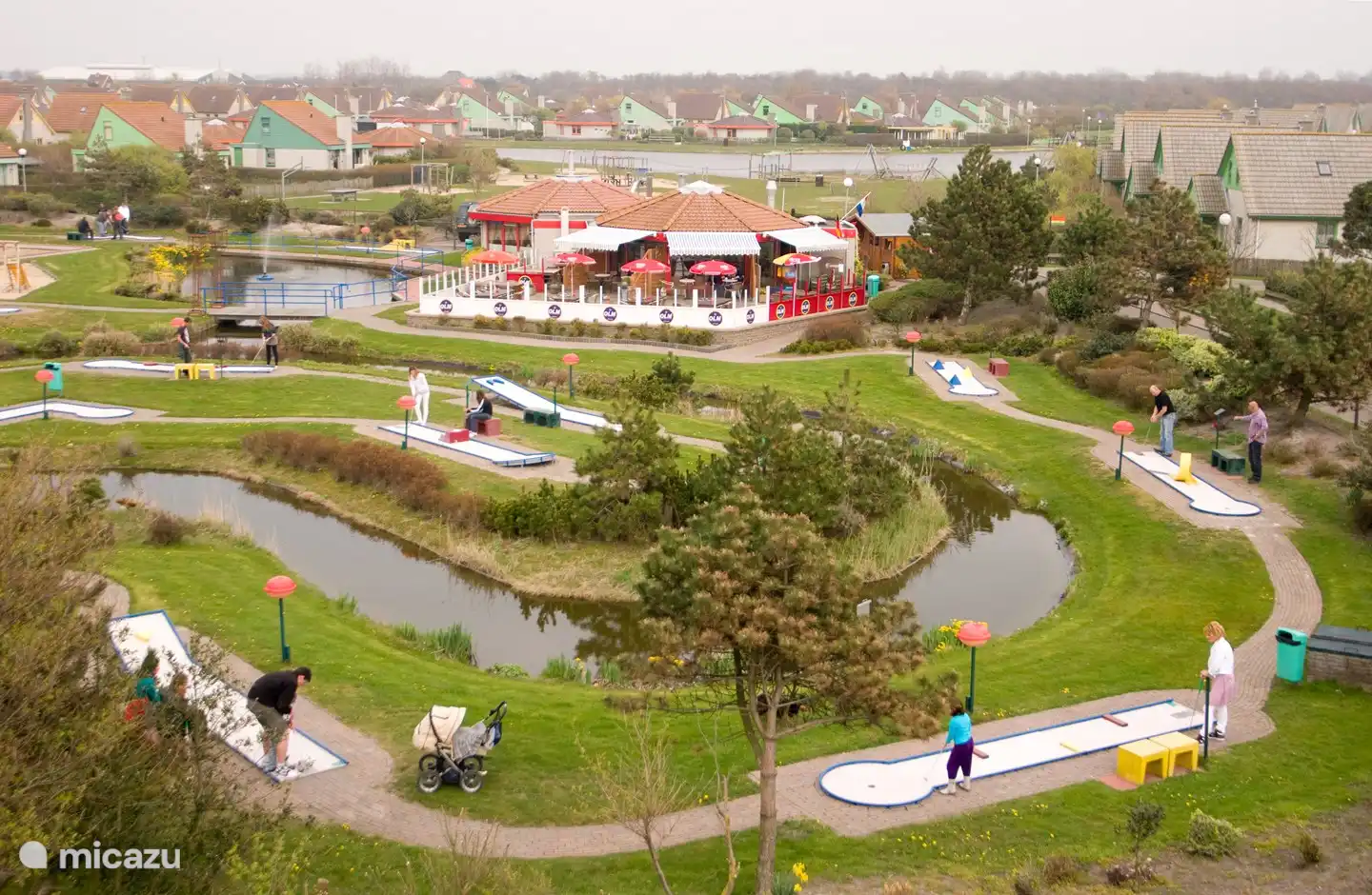 The mini golf course and the cozy restaurant in the park.