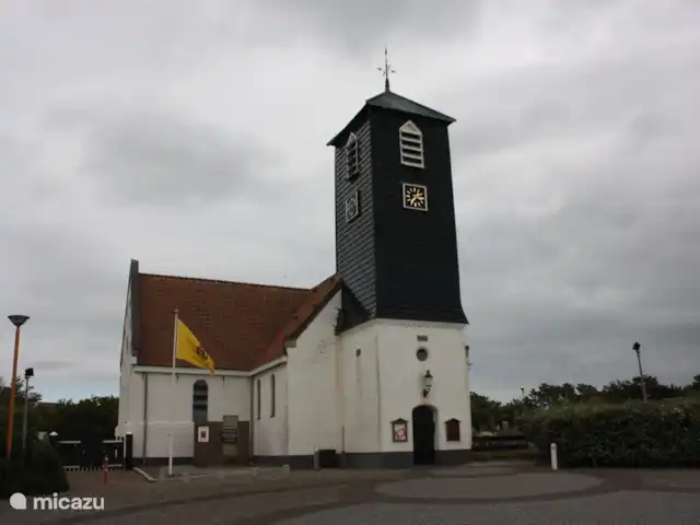 Appartement Plage Retour à la Côte | Pays-Bas, Hollande du Nord, Callantsoog - appartement L'église pittoresque de Callantsoog avec des cimetières de guerre et des services hebdomadaires.