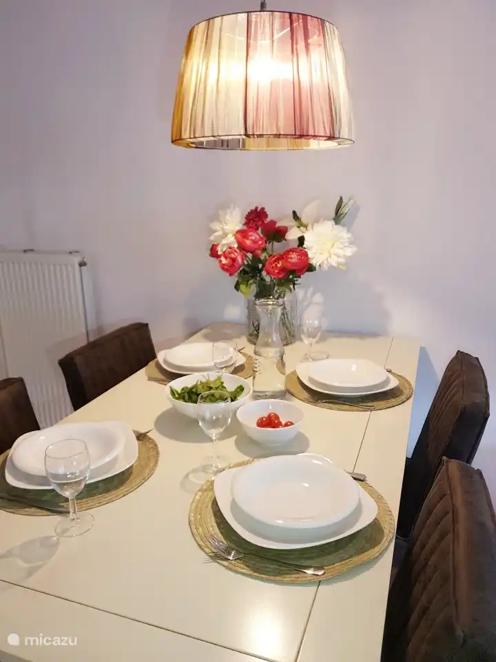 Four new chairs, new lamp, new accessories and piles of crockery, cutlery and glasses to set the table nicely.