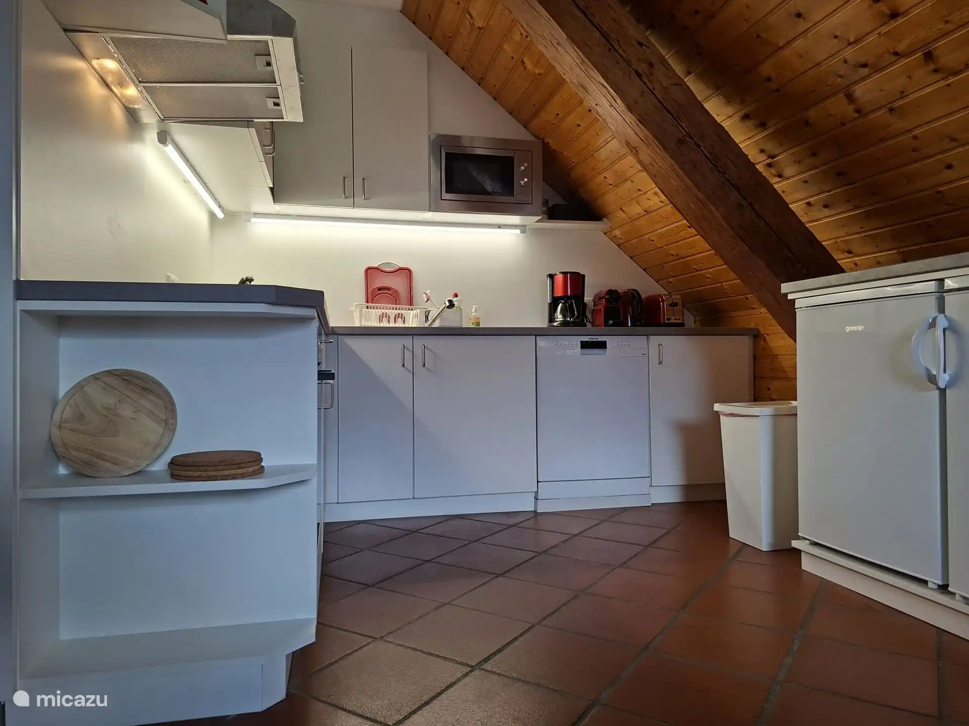 New kitchen with hob, oven, microwave, coffee maker, Nespresso machine, hot water kettle, toaster, two fridges (one with freezer) and dishwasher.
