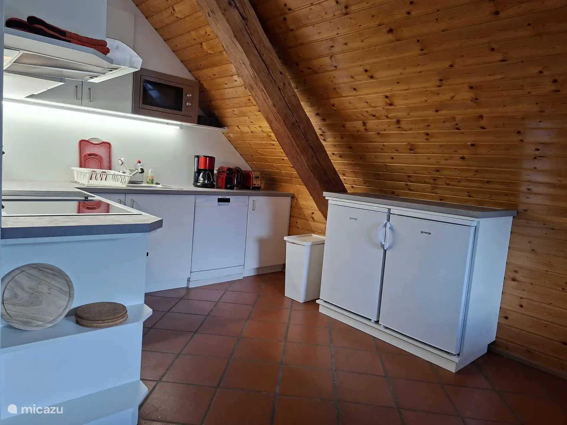New kitchen with hob, oven, microwave, coffee maker, Nespresso machine, hot water kettle, toaster, two fridges (one with freezer) and dishwasher.