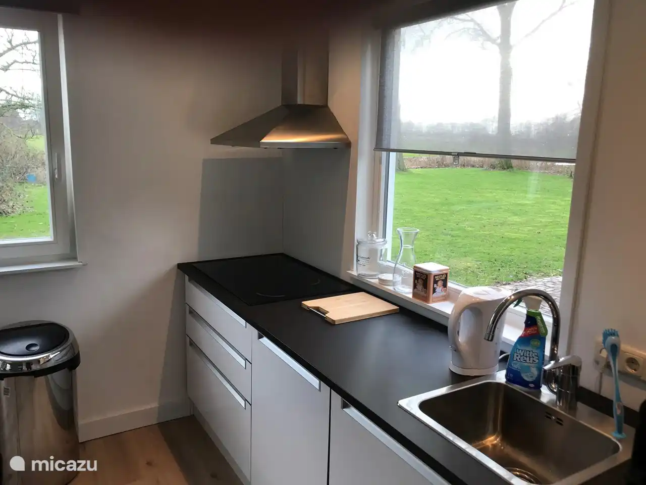 kitchen with dishwasher, induction hob, oven, fridge with freezer and Nespresso coffee machine