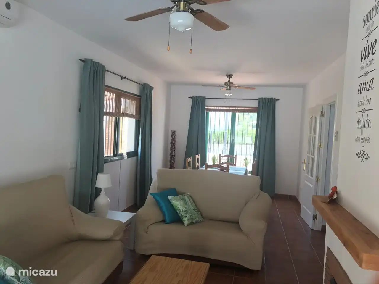 cozy living room with 2 seats to relax and TV with internet connection