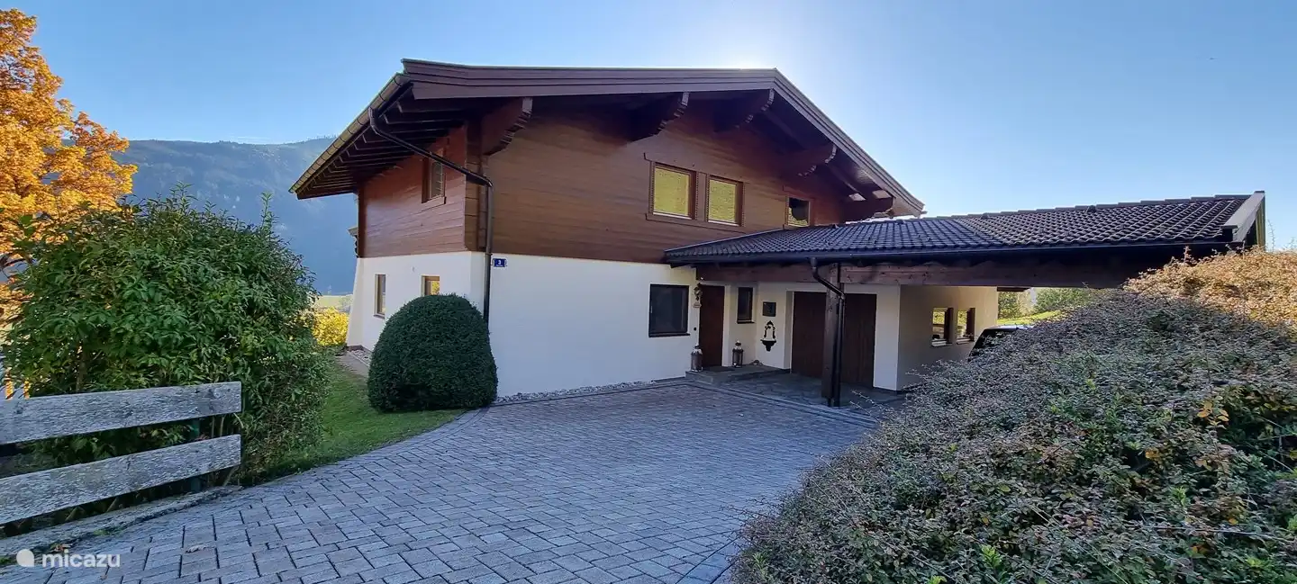 The chalet at the front with ample parking, garage and carport