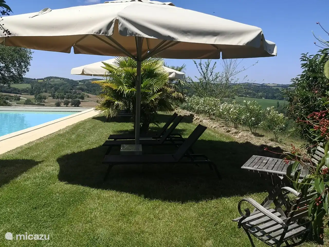 Large umbrellas by the pool