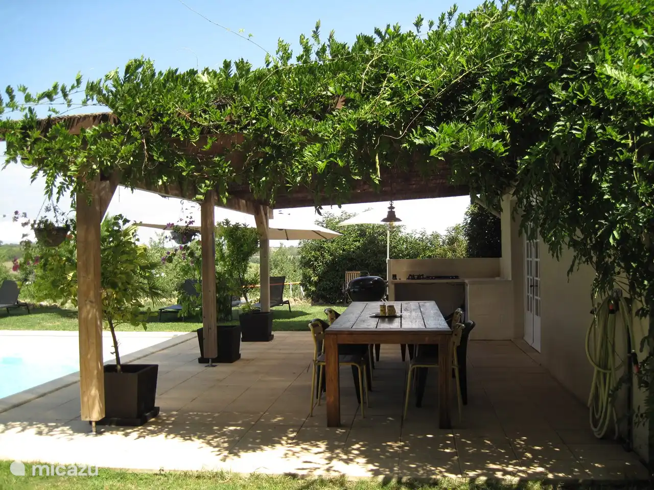Shaded poolside terrace