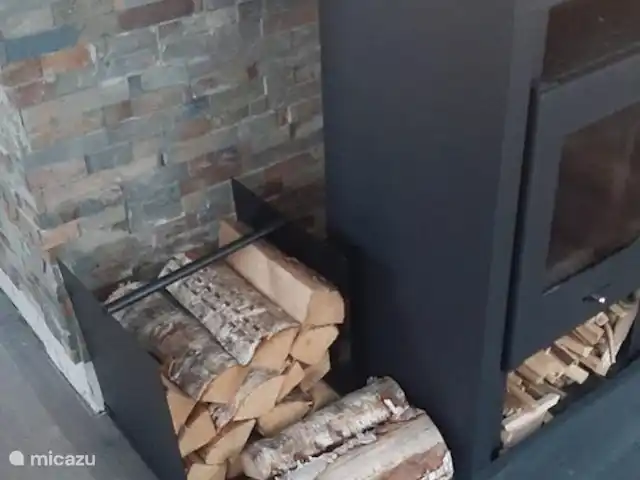 Location de Vacances Suède, Värmland, Nykroppa, maison de vacances - Maison GWEN en lac +service complet Ce poêle à bois crée une ambiance chaleureuse et cosy.