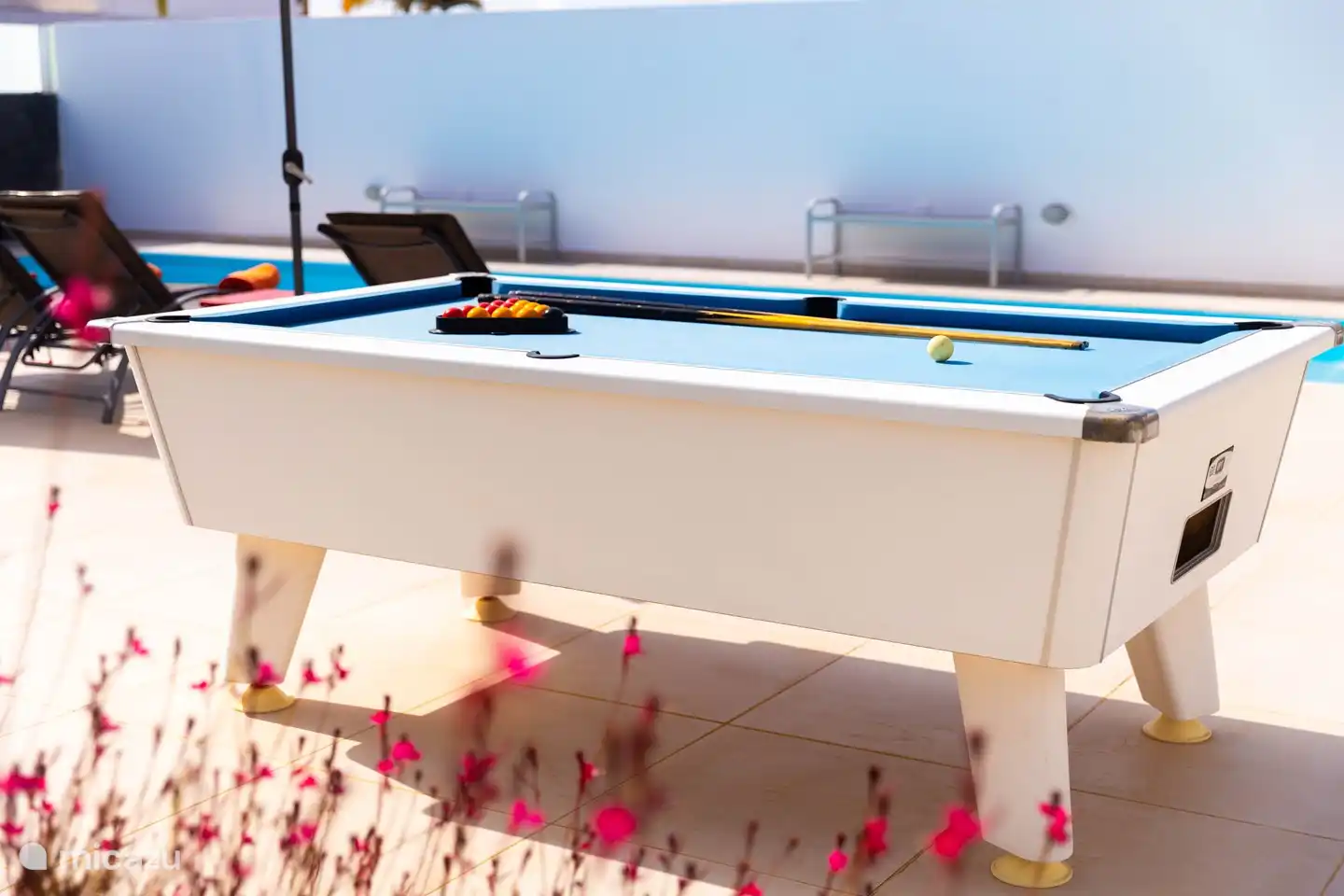 Playing a game of billiards is always fun.