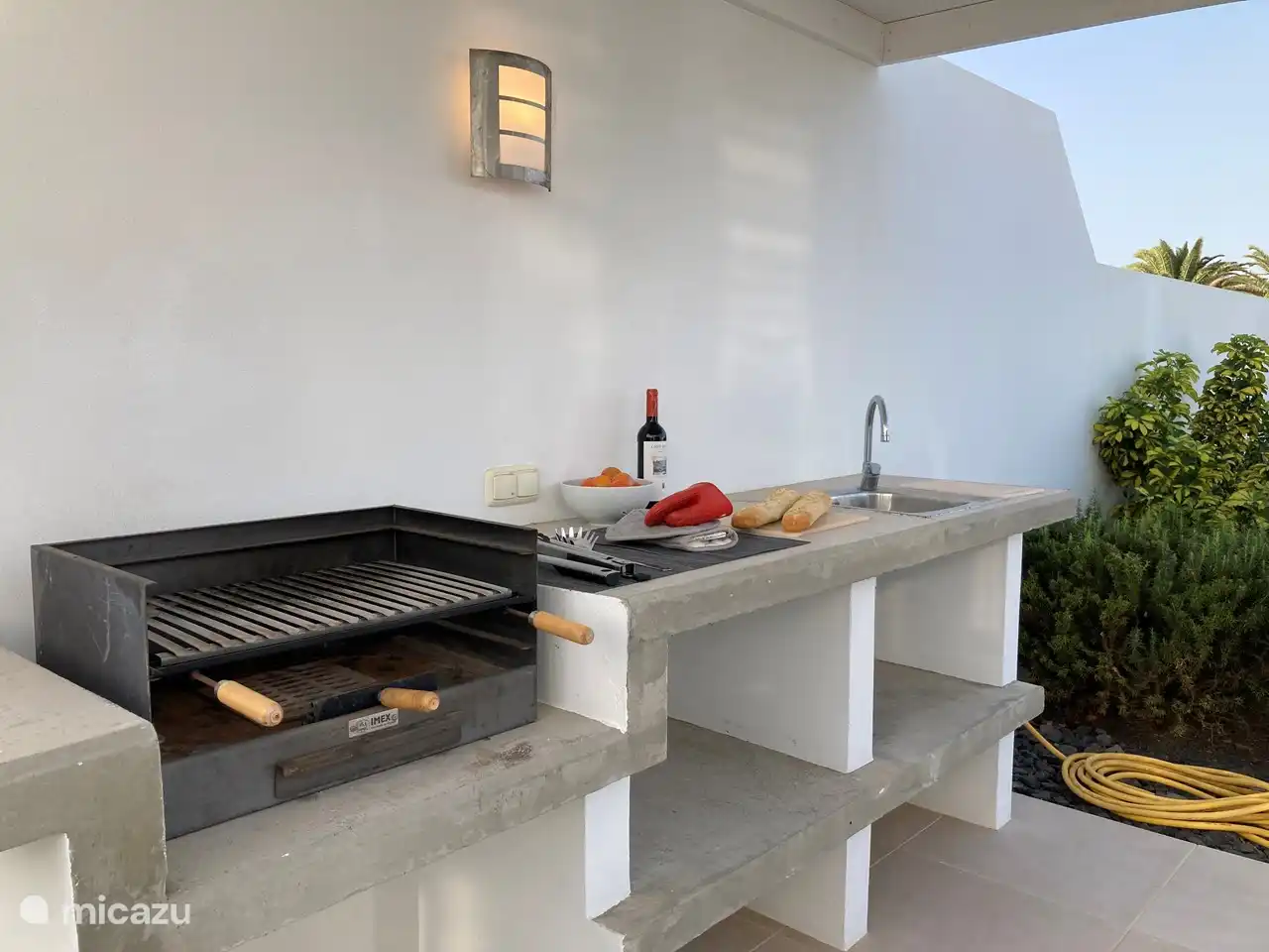 The BBQ and the outdoor sink.