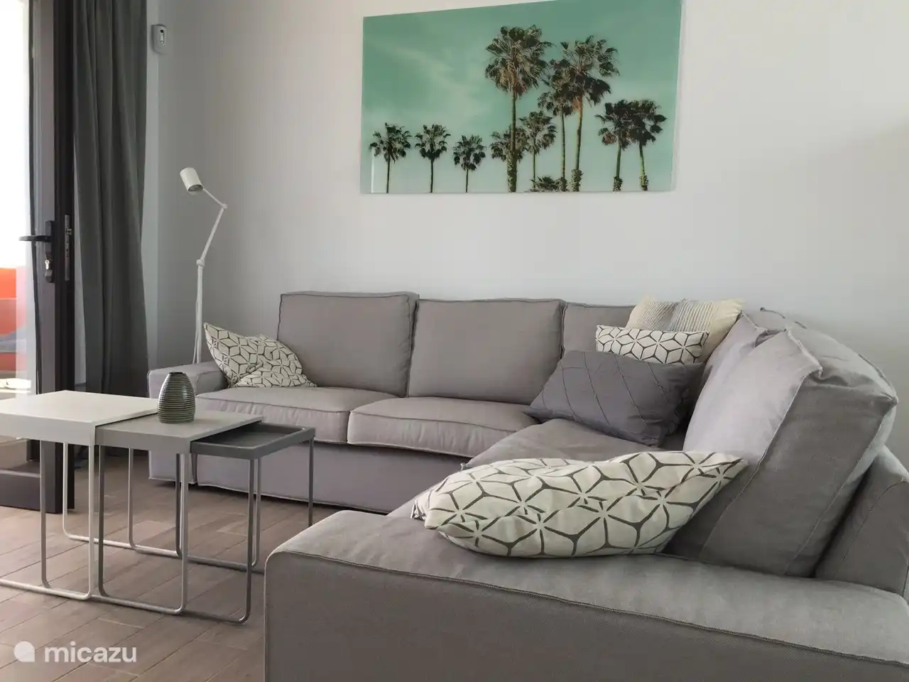 living. If you open the windows wide, you have a beautiful view of the terrace and the garden.