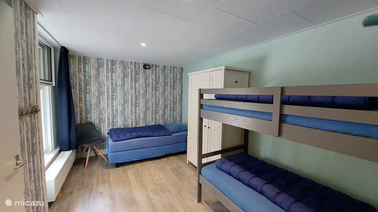 Dormitorio grande para 3 personas