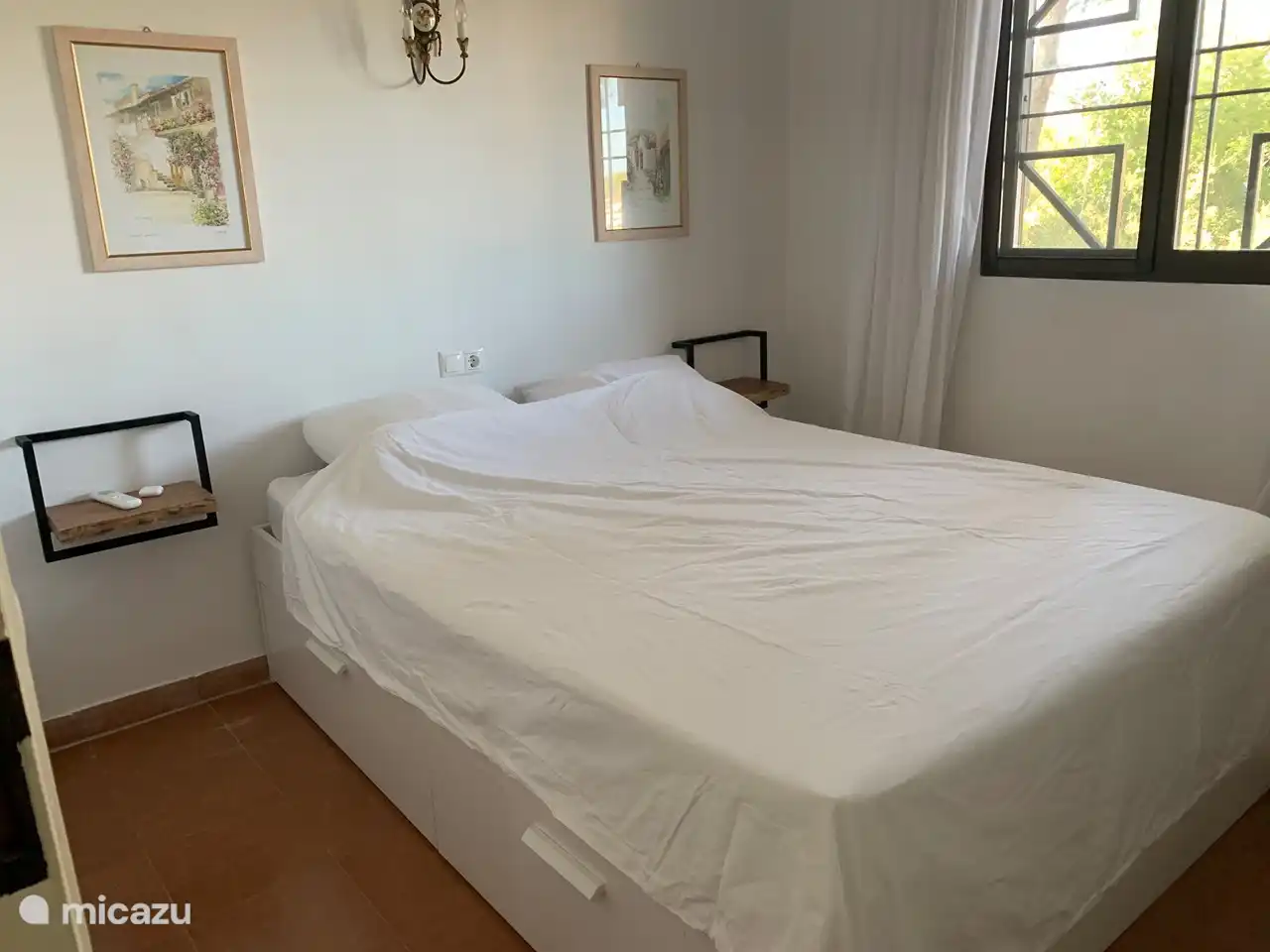 Room 2 with double bed, possibility for storage under the beds and hanging system for clothes in the room, The room is equipped with air conditioning