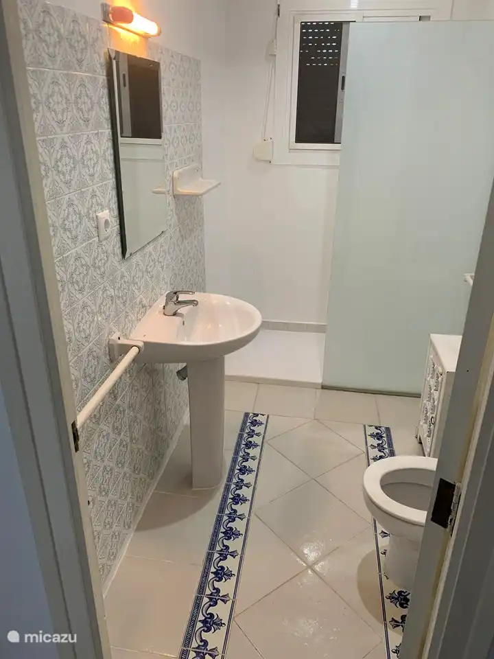 Bathroom 1 with walk-in shower, toilet and sink