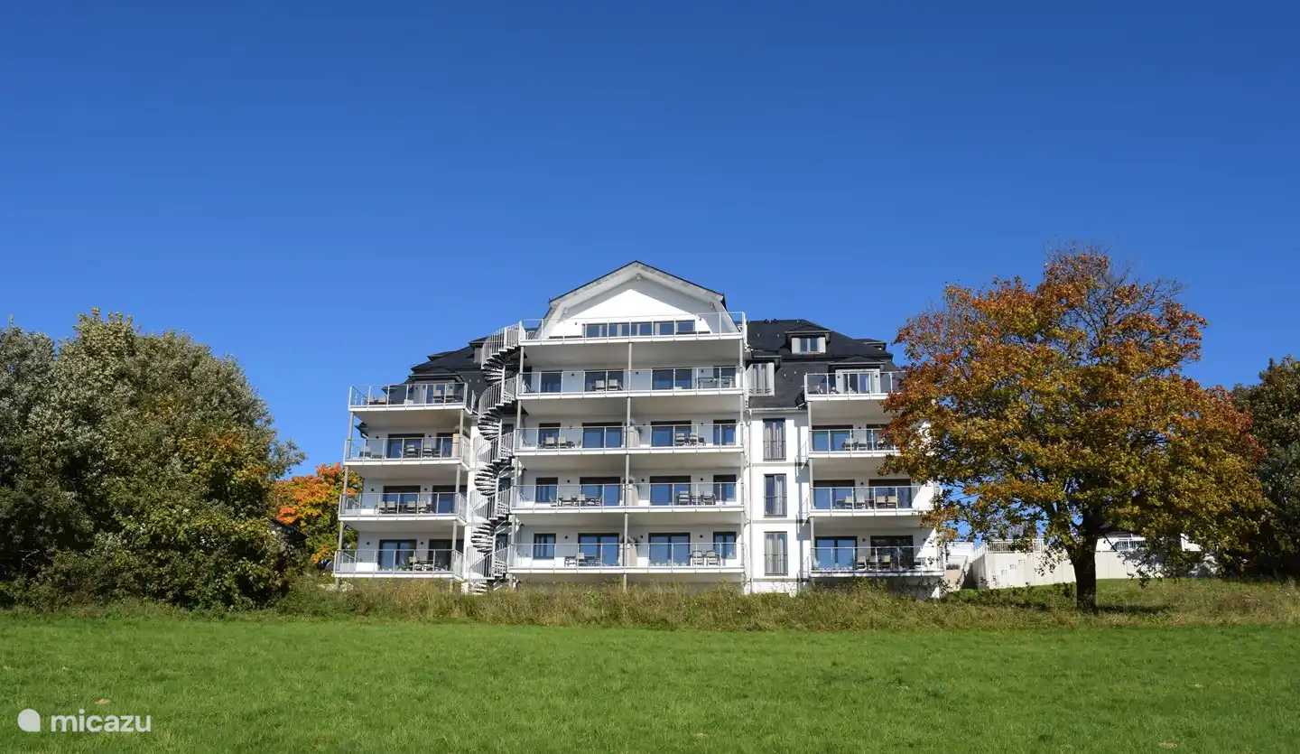 Apartment building with south-facing terrace. Our apartment is left upstairs. 