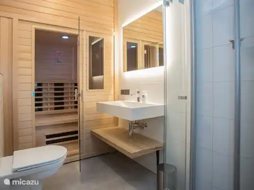 Each bathroom has a rain shower, toilet and sink. There is an IR sauna in the apartment.