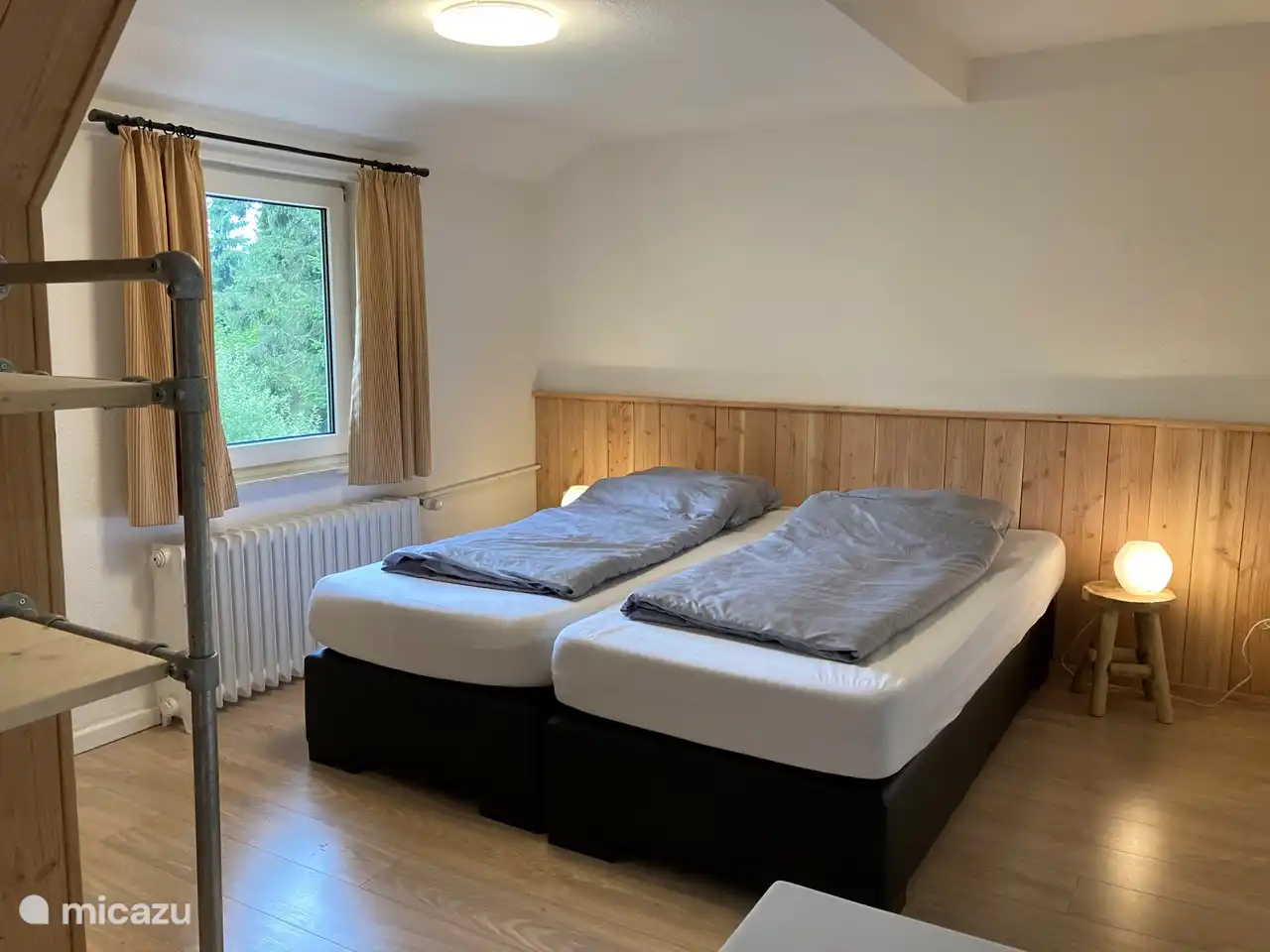 The spacious bedrooms on the second floor are equipped with comfortable beds, a sink and cupboards.