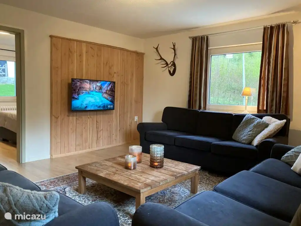 On the first floor, next to the kitchenette, you will find a cozy living room where guests can relax on the couch after an active day.