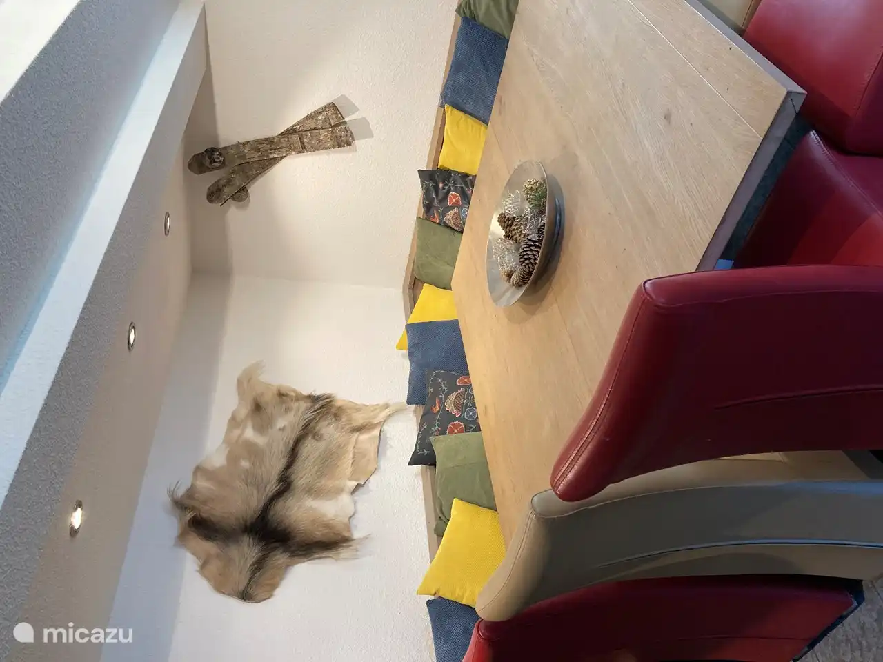 The dining room has a spacious, attractive dining area. There is also a seat for two by the wood stove overlooking the forest valley. Through the dining room you reach the terrace with veranda through French doors.